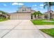 Lovely home with a well-manicured lawn, large driveway, and a spacious three-car garage at 3633 Morgans Bluff Ct, Land O Lakes, FL 34639