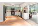 Charming kitchen with two-tone cabinets, stainless steel appliances, butcher block countertops, and sliding glass doors at 3633 Morgans Bluff Ct, Land O Lakes, FL 34639