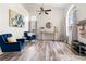 Inviting living area with wood floors, comfortable seating, and plenty of natural light at 3633 Morgans Bluff Ct, Land O Lakes, FL 34639