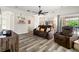 Comfortable living room featuring modern flooring, archways, and a ceiling fan for a stylish and airy space at 3633 Morgans Bluff Ct, Land O Lakes, FL 34639