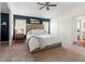 Comfortable main bedroom featuring an ensuite bathroom and ample natural light from the bright windows at 3633 Morgans Bluff Ct, Land O Lakes, FL 34639