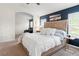 Serene main bedroom with king size bed, ensuite bathroom, and sitting area at 3633 Morgans Bluff Ct, Land O Lakes, FL 34639