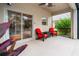 A covered, screened-in outdoor patio with views of the backyard and a sliding glass door at 3633 Morgans Bluff Ct, Land O Lakes, FL 34639