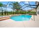 Inviting screened-in pool with spa and lush landscaping for private relaxation at 3633 Morgans Bluff Ct, Land O Lakes, FL 34639