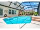 Gorgeous pool area with a screened-in enclosure and plenty of natural light at 3633 Morgans Bluff Ct, Land O Lakes, FL 34639