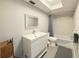 Bright bathroom features a modern vanity, decorative mirror, and tiled shower/tub combination at 3854 Trophy Blvd, New Port Richey, FL 34655
