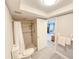 Functional bathroom with a tiled shower, toilet, and towel rack at 3854 Trophy Blvd, New Port Richey, FL 34655