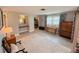 Spacious bedroom with a makeup vanity, window and ample space for furniture at 3854 Trophy Blvd, New Port Richey, FL 34655