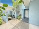 Cozy home entrance with an outdoor seating area, perfect for relaxing and enjoying the surroundings at 3854 Trophy Blvd, New Port Richey, FL 34655