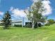The house has an attractive front yard with fresh green grass and appealing landscaping at 3854 Trophy Blvd, New Port Richey, FL 34655