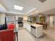 Well-lit kitchen and dining area with modern stainless steel appliances and a bright, airy design at 3854 Trophy Blvd, New Port Richey, FL 34655