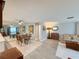 Open-concept living room and dining area with modern flooring and a comfortable seating arrangement at 3854 Trophy Blvd, New Port Richey, FL 34655