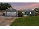 Inviting single-story home featuring a lush lawn, two car garage and a quaint front porch at 3905 31St W Ave, Bradenton, FL 34205