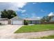 Charming single-story home with a well-manicured lawn and an attached two-car garage at 3905 31St W Ave, Bradenton, FL 34205