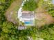 Aerial view of the property highlighting its private lot, backyard pool, and well-maintained landscaping at 4044 Red Fox Ct, Wesley Chapel, FL 33543