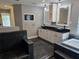 Spacious bathroom features a double sink vanity, soaking tub, and stylish tile work, creating a serene retreat at 4044 Red Fox Ct, Wesley Chapel, FL 33543