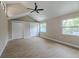 Bedroom features vaulted ceilings, modern fan, and hardwood floors at 4044 Red Fox Ct, Wesley Chapel, FL 33543