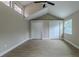 Spacious bedroom with vaulted ceilings, hardwood floors, and large closets at 4044 Red Fox Ct, Wesley Chapel, FL 33543
