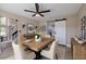 Dining room with a modern light fixture, barn door, and decor at 4044 Red Fox Ct, Wesley Chapel, FL 33543