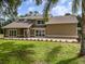 Charming home features large windows, manicured lawn, and fresh landscaping at 4044 Red Fox Ct, Wesley Chapel, FL 33543