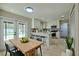 Eat in kitchen with white cabinetry, stainless steel appliances, and eat-in island area at 4044 Red Fox Ct, Wesley Chapel, FL 33543