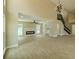 Open living area features wood floors, a modern fireplace, and access to the backyard at 4044 Red Fox Ct, Wesley Chapel, FL 33543