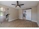 An open concept living room area featuring a large barn door to the kitchen at 4044 Red Fox Ct, Wesley Chapel, FL 33543
