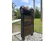 Unique, modern mailbox with clear address numbers set on a lush, landscaped lot at 4044 Red Fox Ct, Wesley Chapel, FL 33543