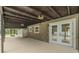 Spacious covered patio with easy access to the pool, offering shade and a serene outdoor experience at 4044 Red Fox Ct, Wesley Chapel, FL 33543