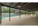A stunning screened-in pool area with a large concrete deck, perfect for outdoor entertaining and relaxation at 4044 Red Fox Ct, Wesley Chapel, FL 33543