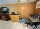 This living room features tile flooring, a television, and furniture at 4214 Trucious Pl # 4212, New Port Richey, FL 34652
