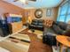 Inviting living room with a fish tank, black leather sectional couch, and unique brown rug at 4214 Trucious Pl # 4212, New Port Richey, FL 34652