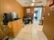 Functional office space with a wooden desk, office chair, and tile floor at 4214 Trucious Pl # 4212, New Port Richey, FL 34652