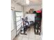 Enclosed patio featuring an elliptical machine and ceiling fan at 4214 Trucious Pl # 4212, New Port Richey, FL 34652