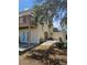 A private backyard patio area with stairs to a second story balcony at 4304 Harbor House Dr, Tampa, FL 33615