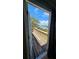 View of a balcony overlooking a waterway with boats and lush greenery at 4304 Harbor House Dr, Tampa, FL 33615