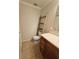 Bathroom featuring a vanity with wood finish and a toilet, complemented by tiled flooring at 4304 Harbor House Dr, Tampa, FL 33615