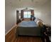 Bright bedroom with a view, featuring hardwood floors, light walls, and a comfortable bed, creating a serene and inviting space at 4304 Harbor House Dr, Tampa, FL 33615