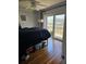 Bedroom featuring a ceiling fan and sliding door to deck with waterfront view at 4304 Harbor House Dr, Tampa, FL 33615