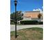 View of home exterior, shrubbery, and partial lawn area on a sunny day at 4304 Harbor House Dr, Tampa, FL 33615