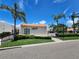 Charming condo exterior with lush landscaping and a distinctive copper-colored roof at 4304 Harbor House Dr, Tampa, FL 33615