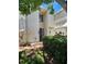Charming exterior featuring a vibrant blue door, neat landscaping, and a well-kept facade at 4304 Harbor House Dr, Tampa, FL 33615