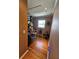 Hallway with hardwood floors leading to windowed room with ample storage and natural lighting at 4304 Harbor House Dr, Tampa, FL 33615
