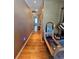 Hallway with hardwood floors and built in shelving and storage units at 4304 Harbor House Dr, Tampa, FL 33615