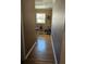Hallway with plants and a window provides natural light and a tranquil aesthetic at 4304 Harbor House Dr, Tampa, FL 33615