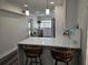 Kitchen featuring stainless steel appliances, quartz counters, and a breakfast bar at 4304 Harbor House Dr, Tampa, FL 33615