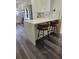 The kitchen island features counter seating with luxury stools, perfect for casual dining and entertaining at 4304 Harbor House Dr, Tampa, FL 33615