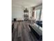 A spacious living room offers sleek floors, lots of natural light, and a comfortable seating area at 4304 Harbor House Dr, Tampa, FL 33615