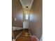 Bright staircase with star pendant lighting illuminating the hallway and hardwood steps at 4304 Harbor House Dr, Tampa, FL 33615
