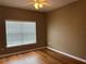 Cozy bedroom featuring hardwood floors, neutral walls, and a window for natural light at 4305 Bayside Village Dr # 301, Tampa, FL 33615